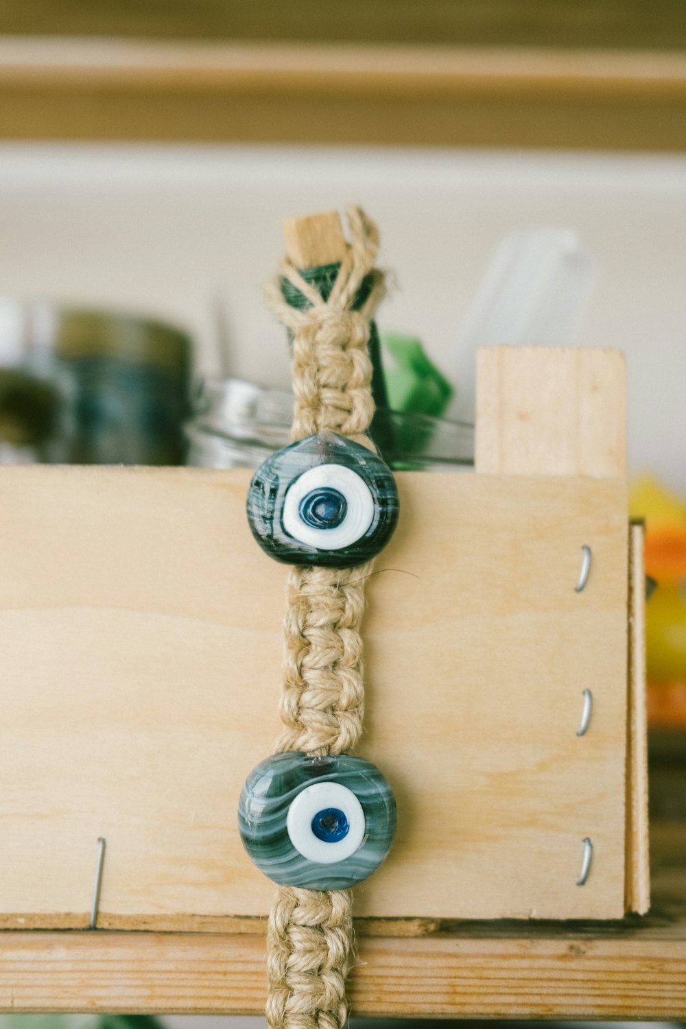 a wooden box with a couple of blue eyes and a blue eyeball