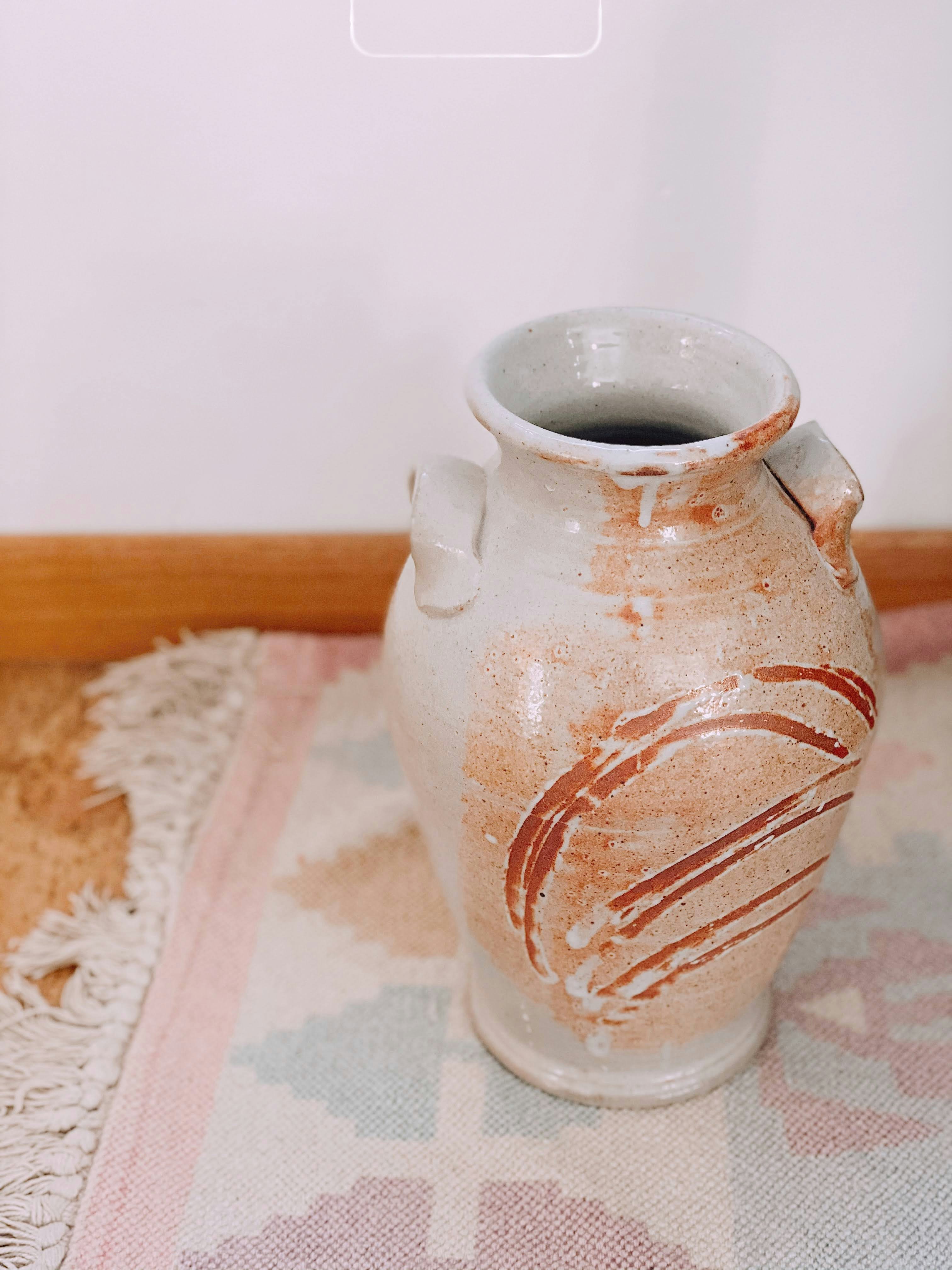a glass pitcher with a brown liquid