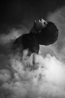 a person lying in the clouds