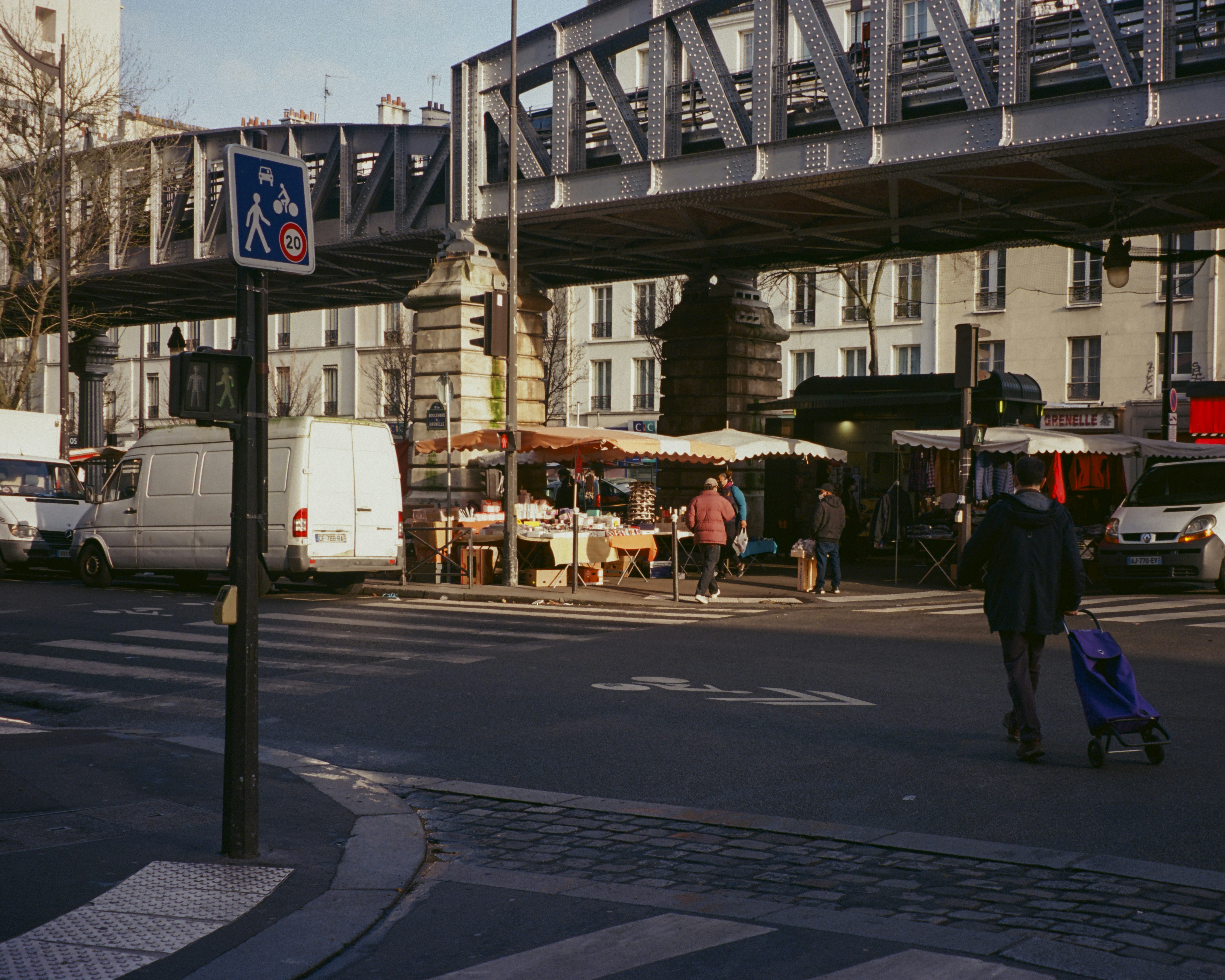 a street with people and cars