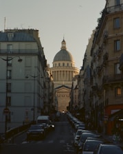 a street with cars and buildings on either side of it
