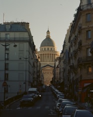 a street with cars and buildings on either side of it