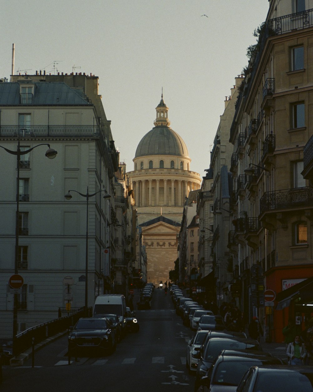 a street with cars and buildings on either side of it