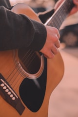 a person playing a guitar