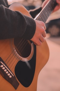 a person playing a guitar