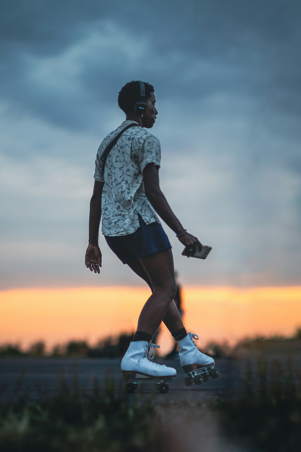 a man skateboarding on a road