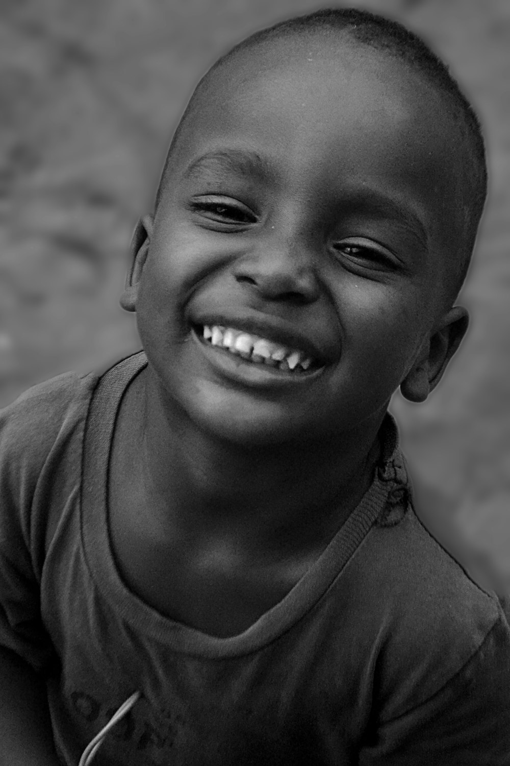 a close-up of a young boy smiling