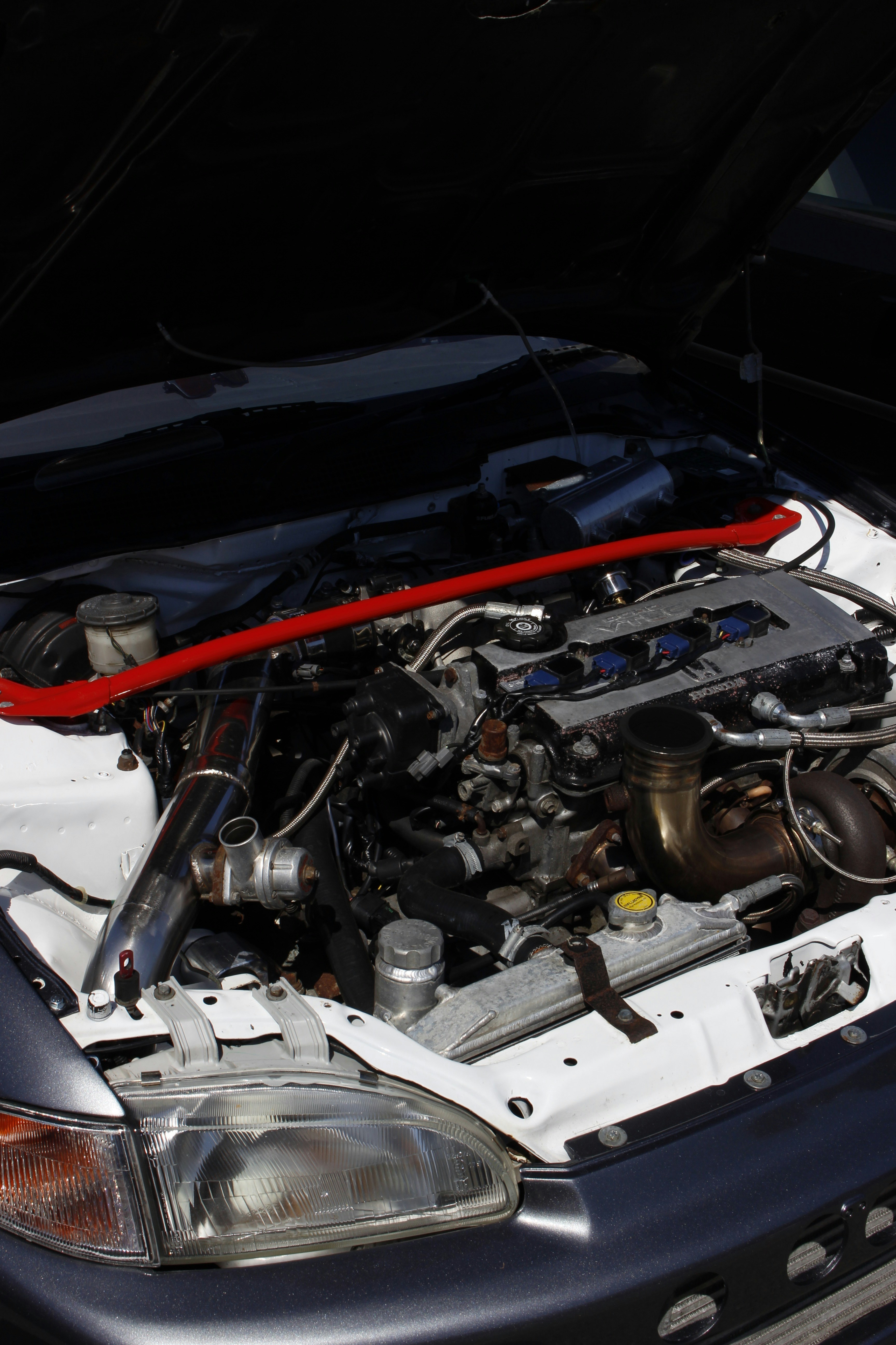 A car engine with its hood open photo – Free Car events Image on Unsplash