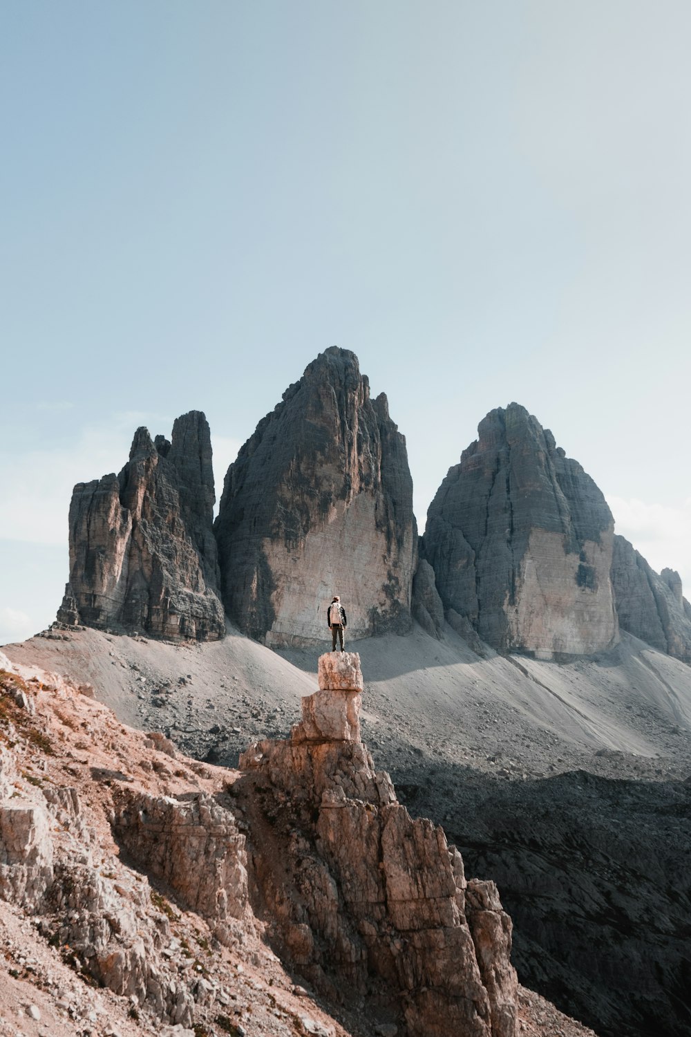 a person standing on a rock