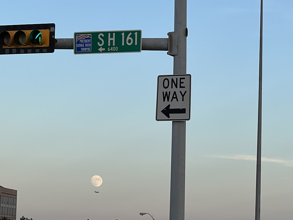 a street sign and a traffic light