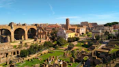 an old city with many buildings with Roman Forum in the background