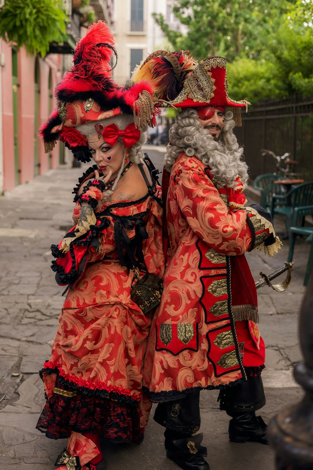 a man and woman dressed up in traditional clothing