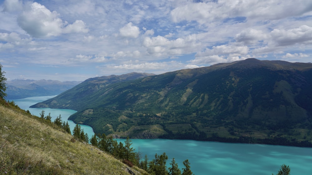 a body of water with hills around it