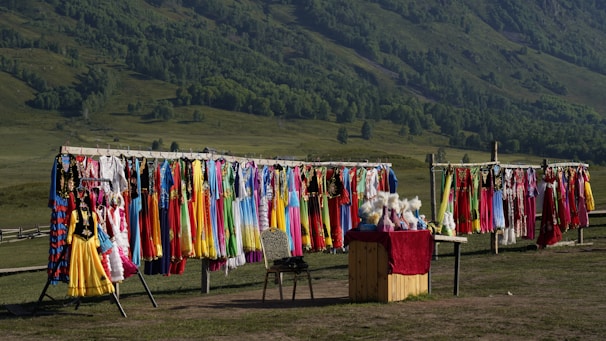 A colorful display of summer and winter garments reflecting Indian landscapes and traditions.