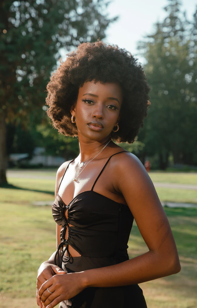 Natural-light portrait of a Black woman with curly hair