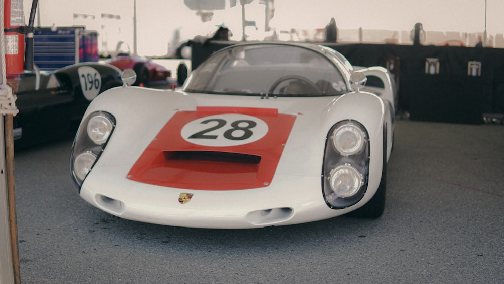 a white sports car with a cartoon face on it