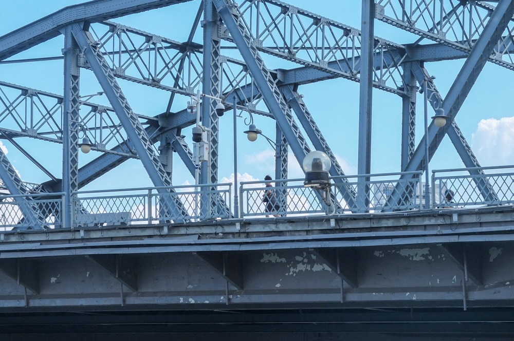 a group of people on a bridge