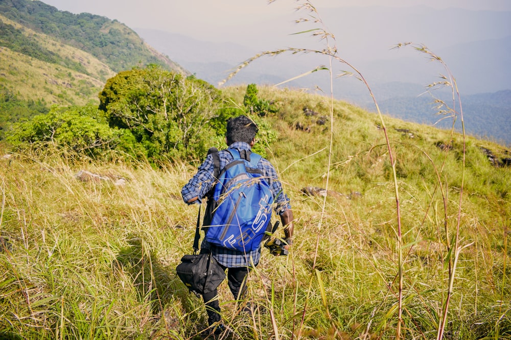 a person walking through a grassy area