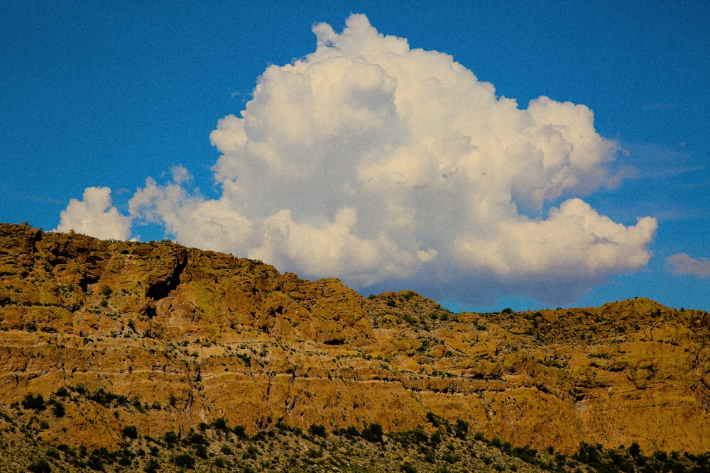 a mountain with a cloud in the sky