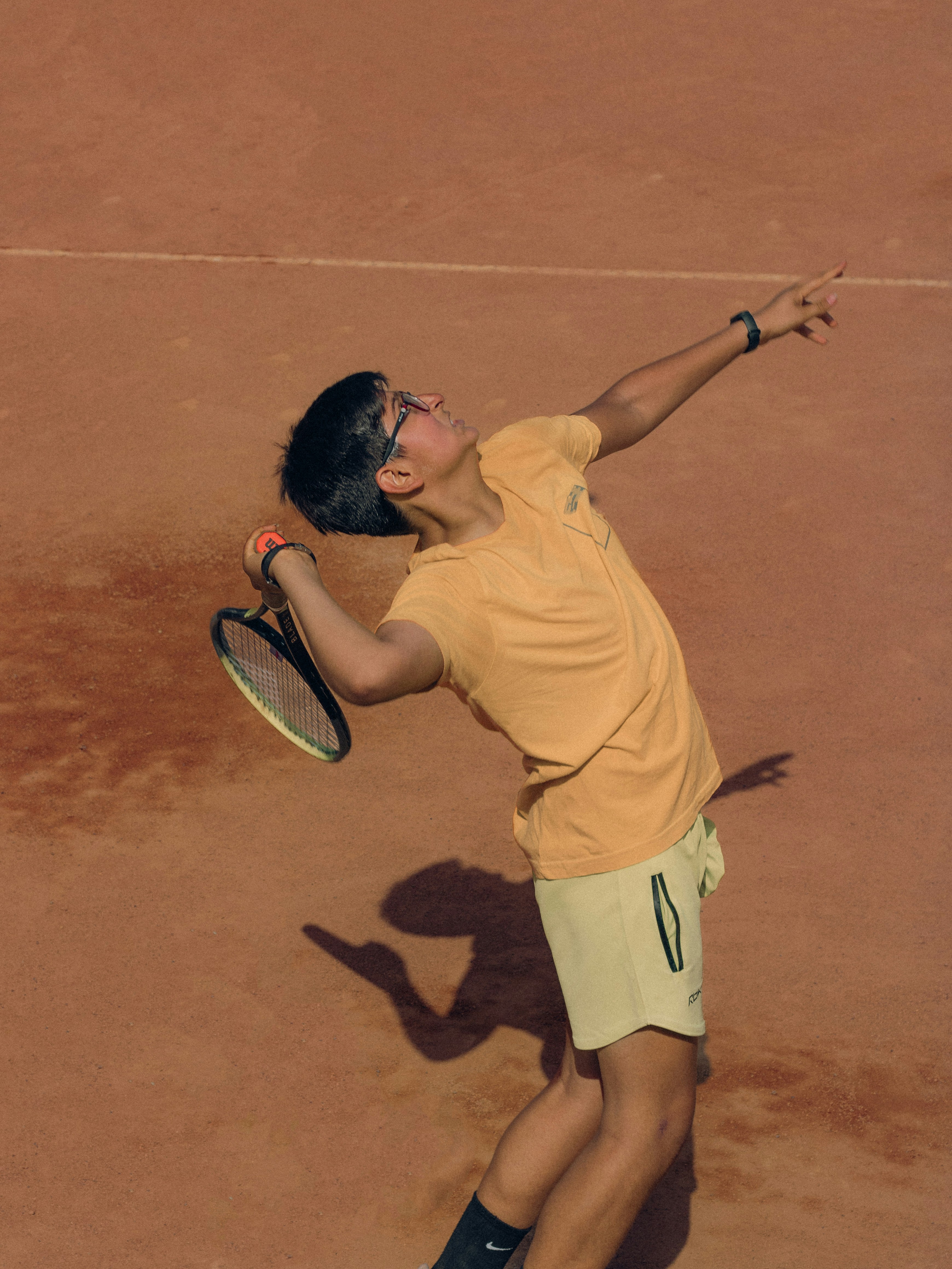 Tennis player preparing for a serve during a match