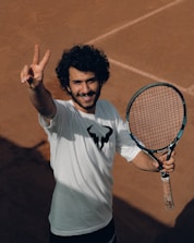 a man holding a tennis racket