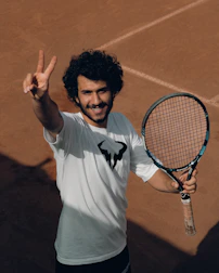 a man holding a tennis racket