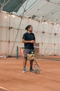 a man holding a tennis racket