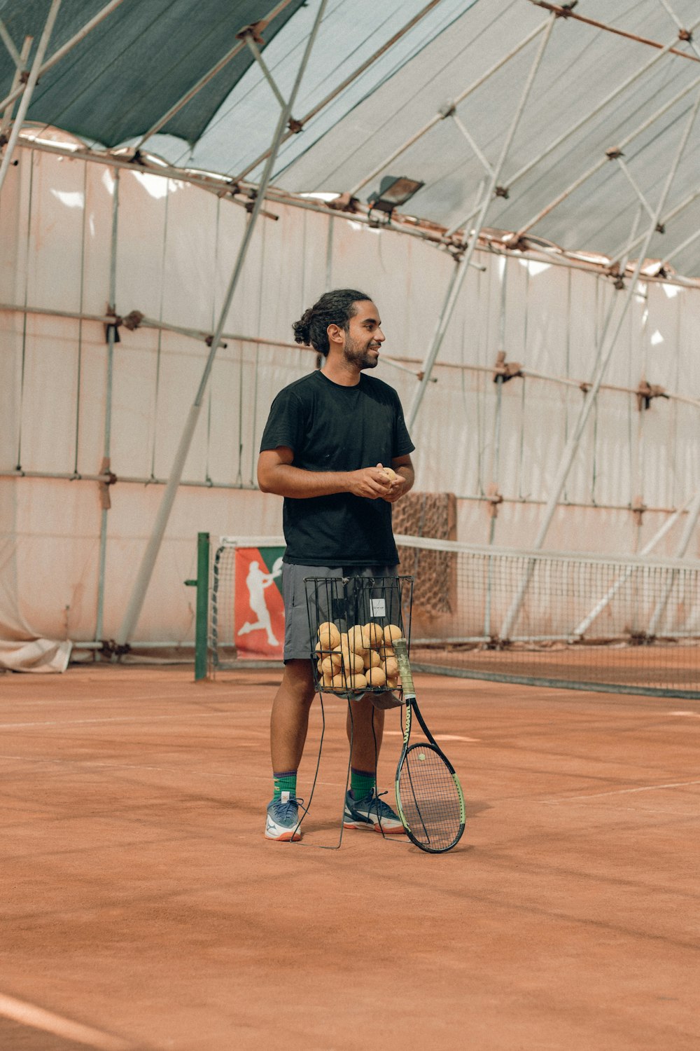 a man holding a tennis racket