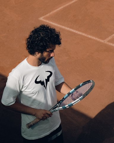 a man holding a tennis racket