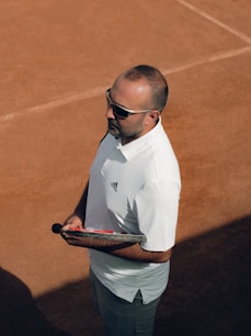 a man holding a tennis racket
