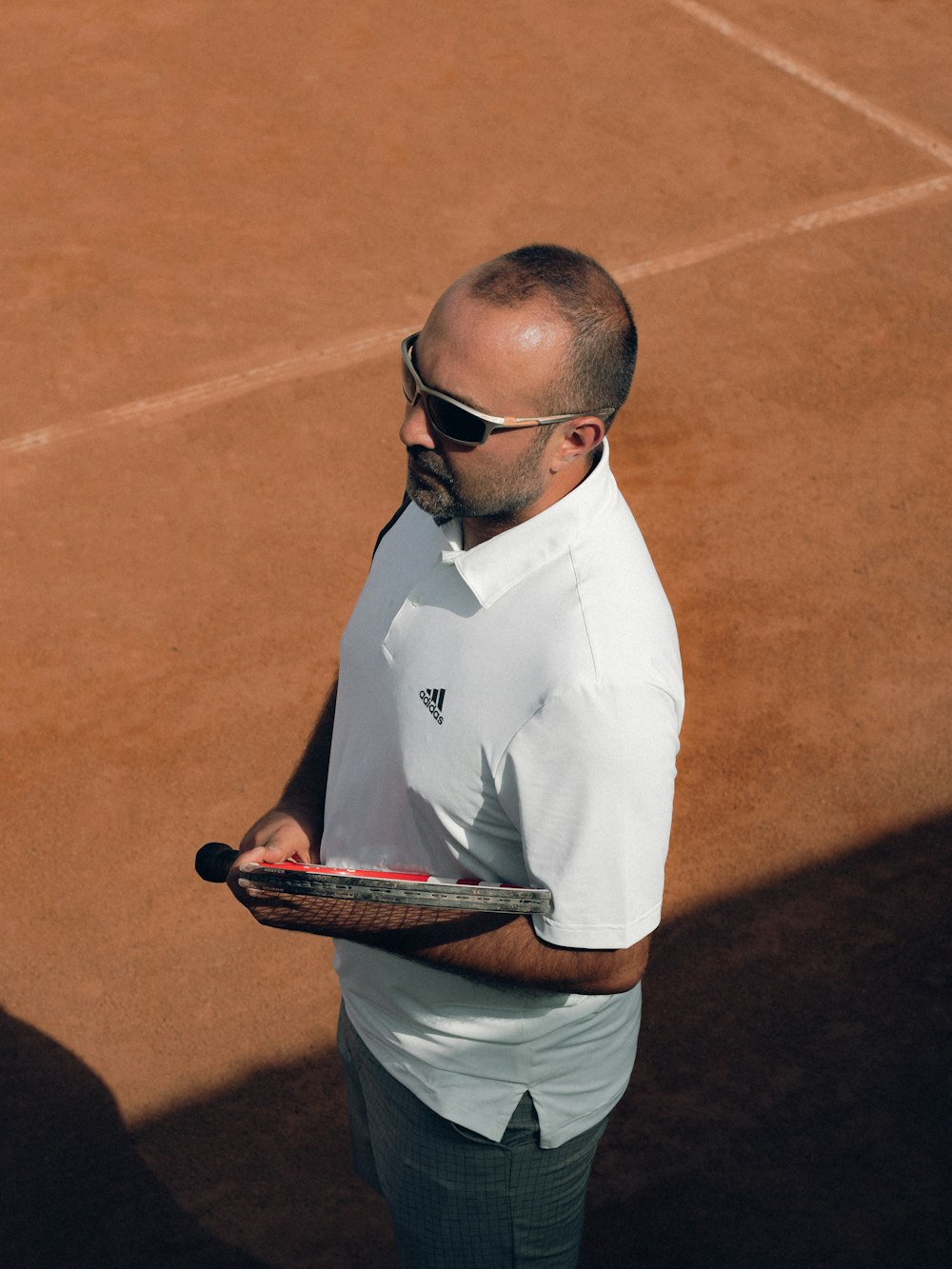 a man holding a tennis racket