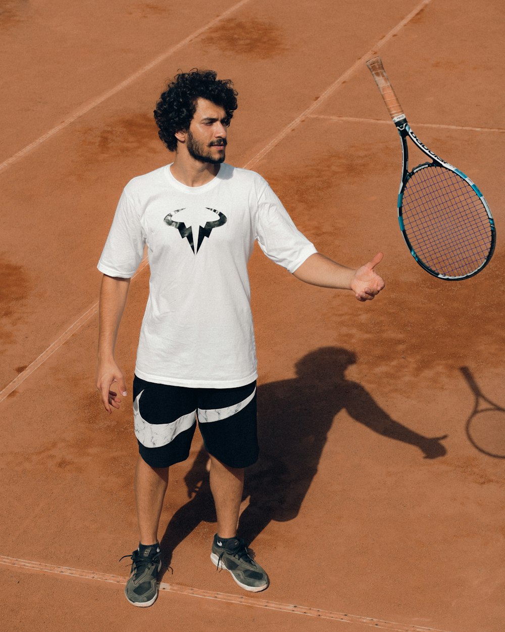 a man holding a tennis racket