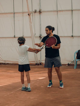 a couple of men playing tennis