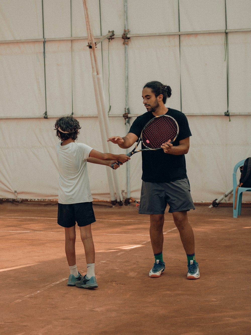 a couple of men playing tennis