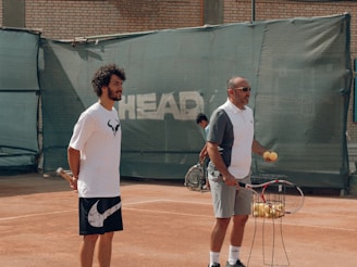 a couple of men playing tennis