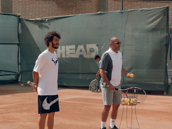 a couple of men playing tennis