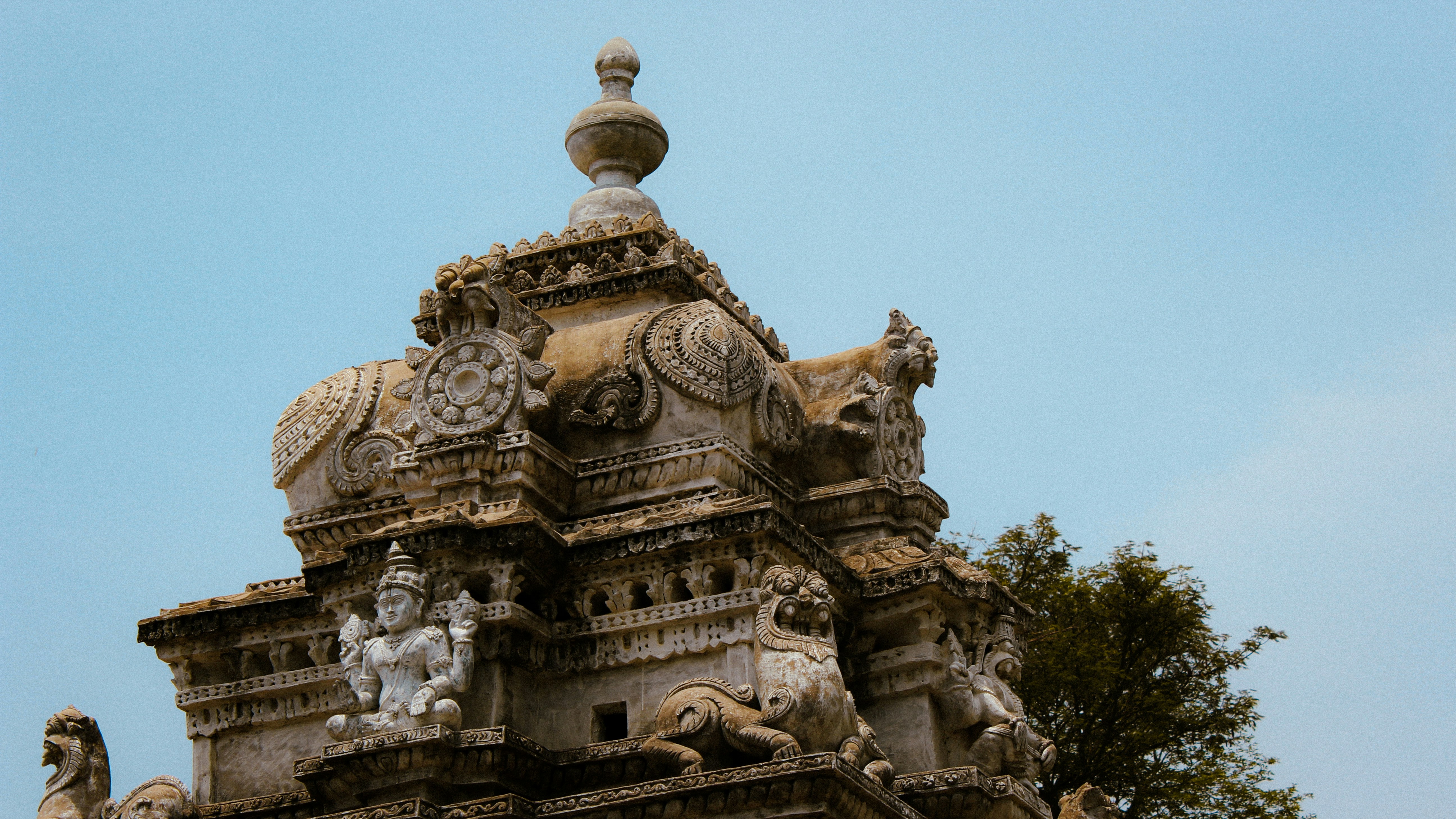 a large stone building with statues