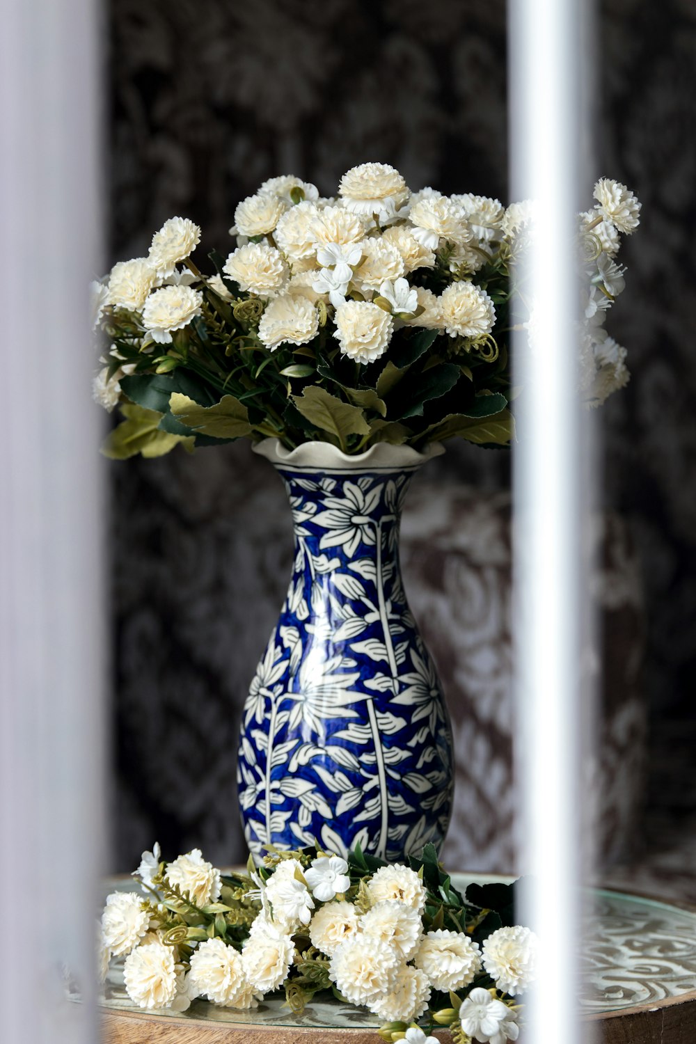 a vase with white flowers