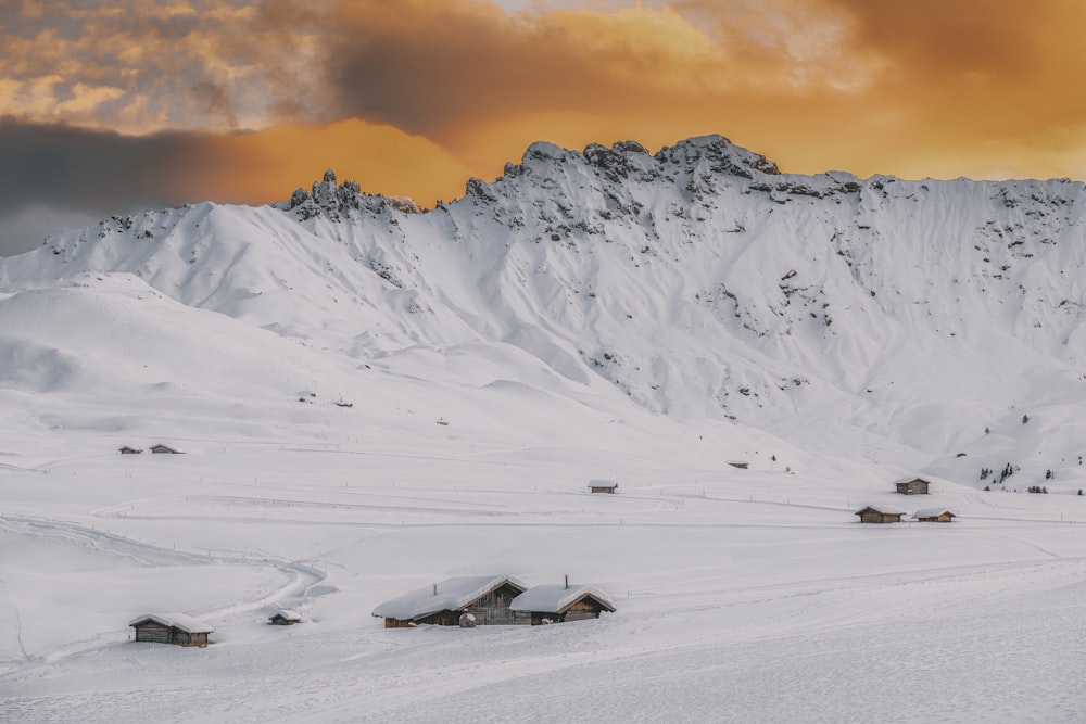 a group of buildings in a snowy area