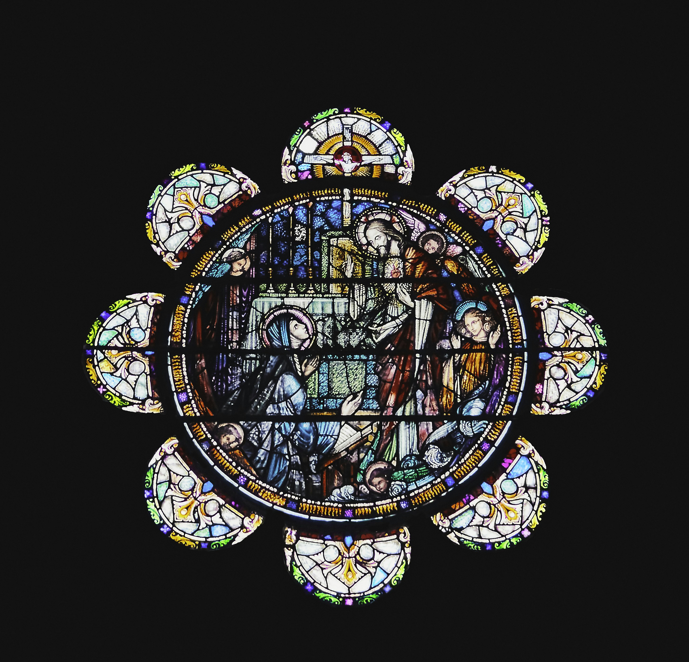 a circular window with colorful glass