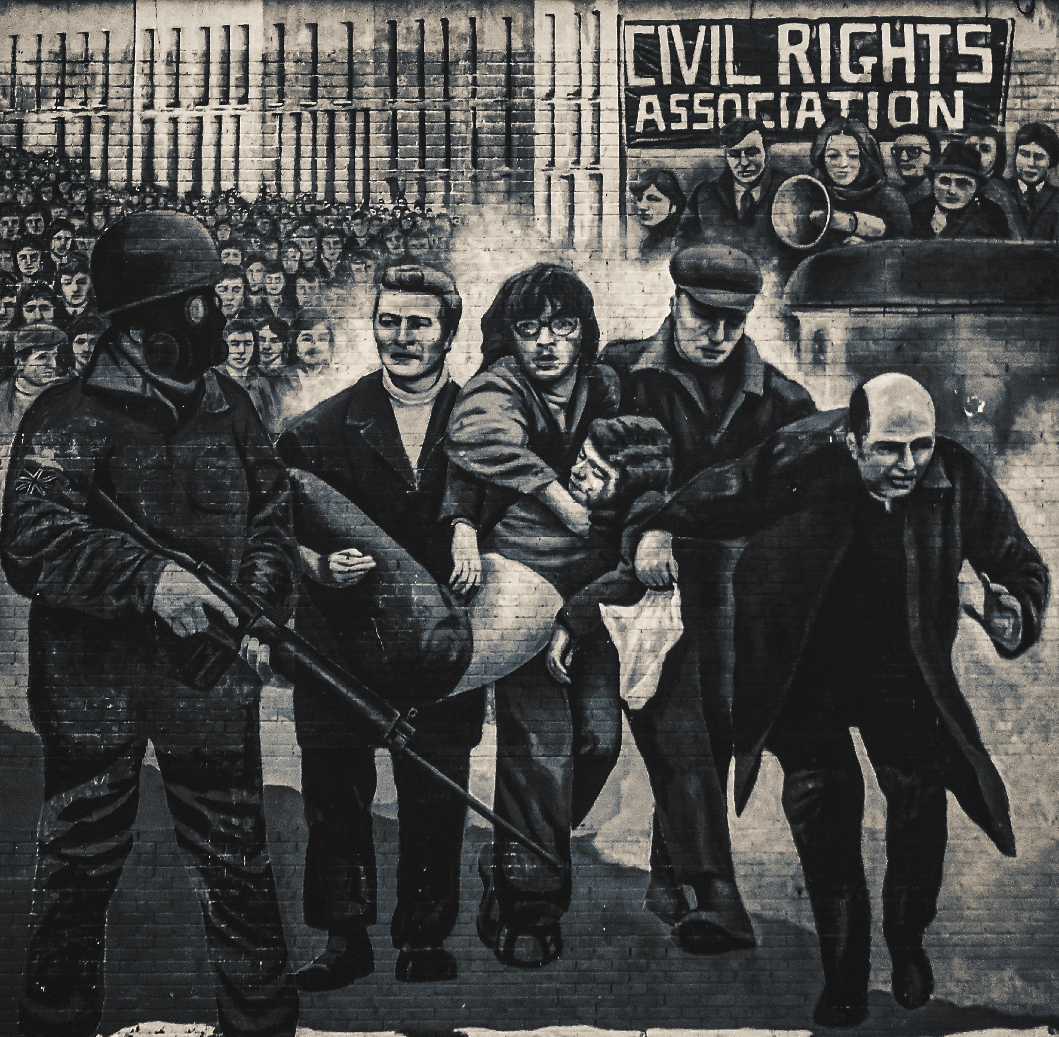 A mural at Free Derry Corner in Londonderry depicting Bloody Sunday, a significant historical event in Northern Ireland's Civil War (photo taken, May, 2021). This image is reproduced with permission of the artists, \