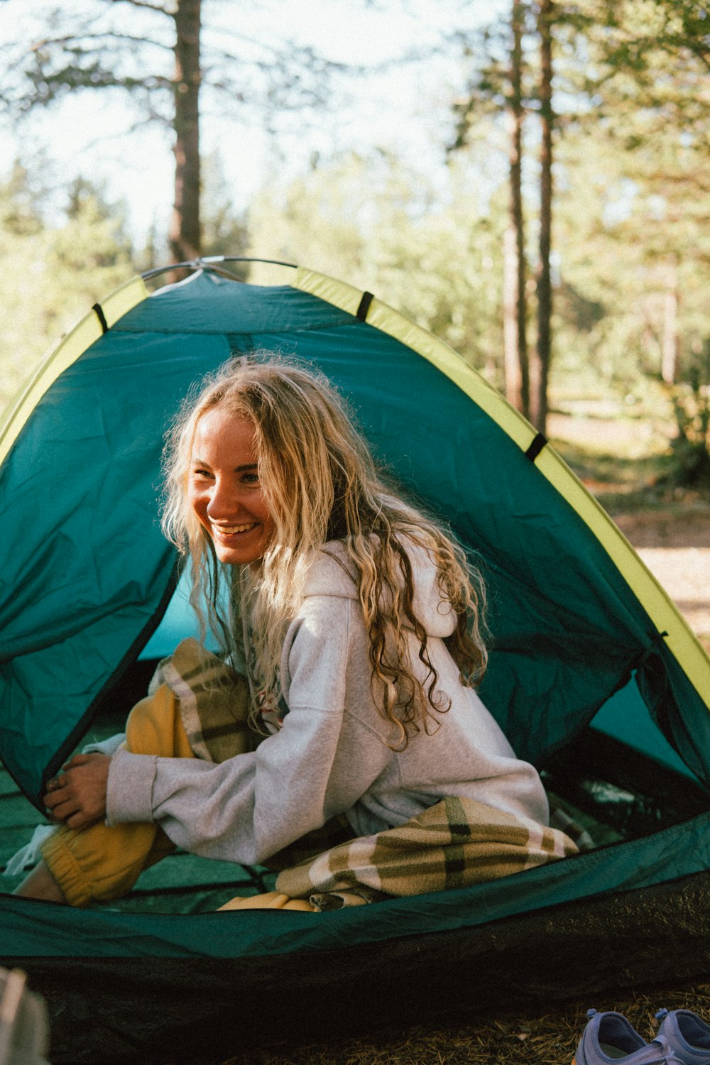 a person sitting in a tent