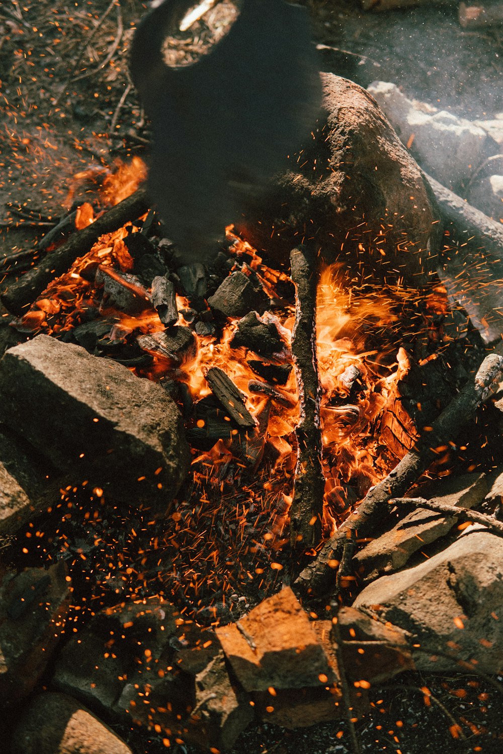 a fire burning in a pit