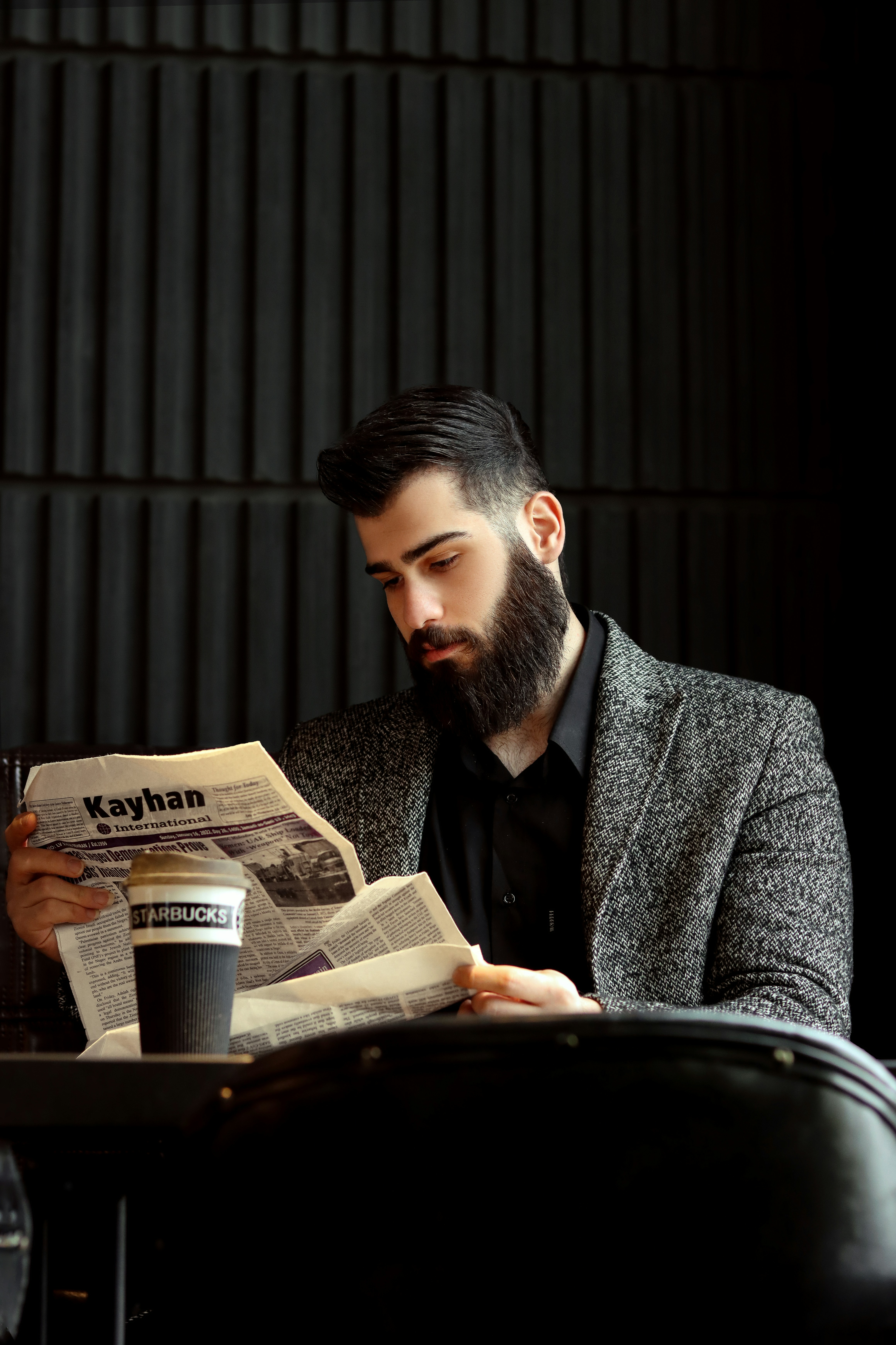 a man reading a newspaper