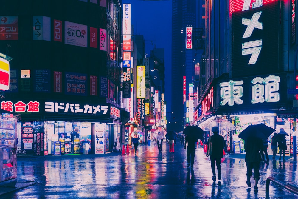 people walking in the rain