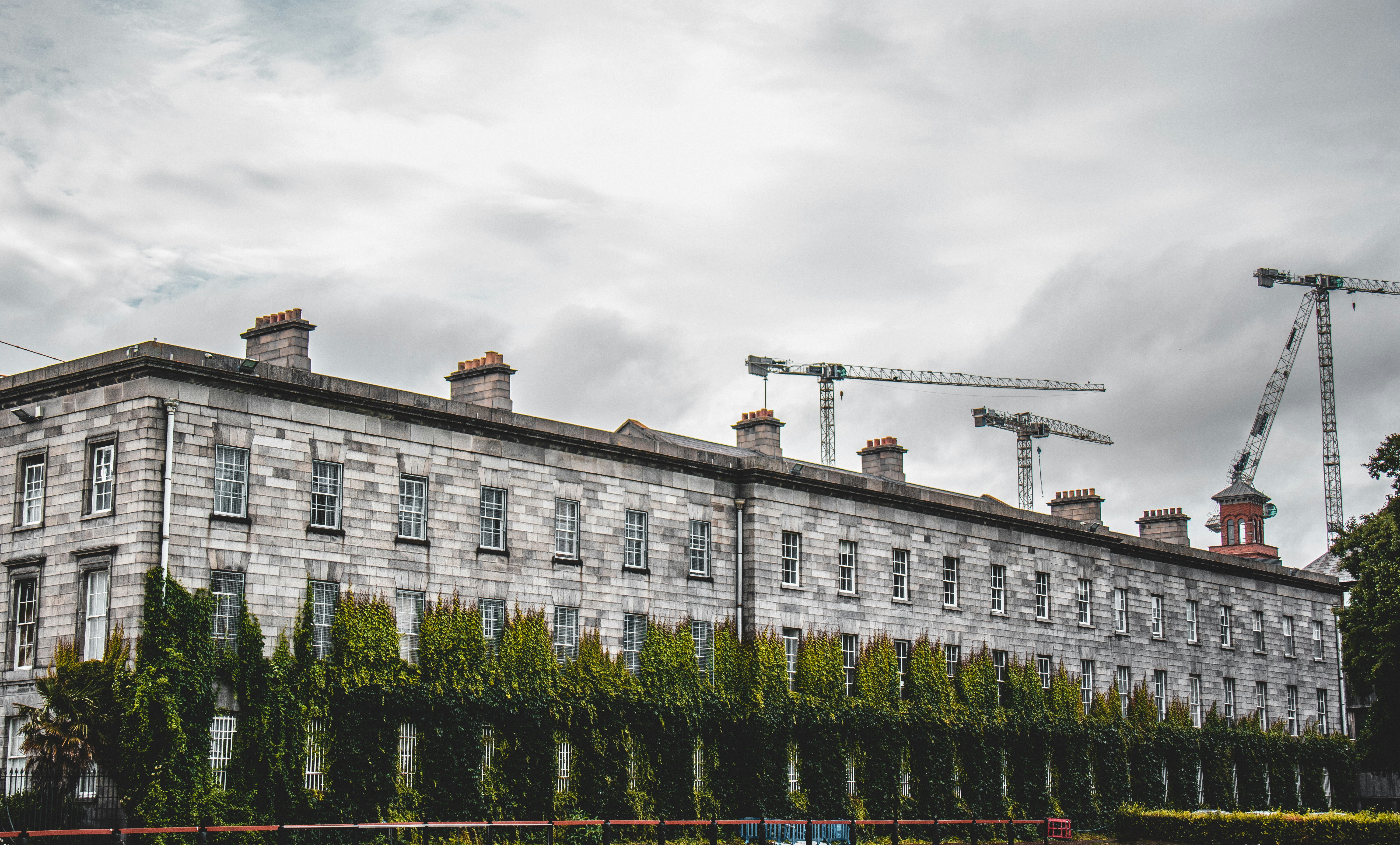 a building with a crane in the background