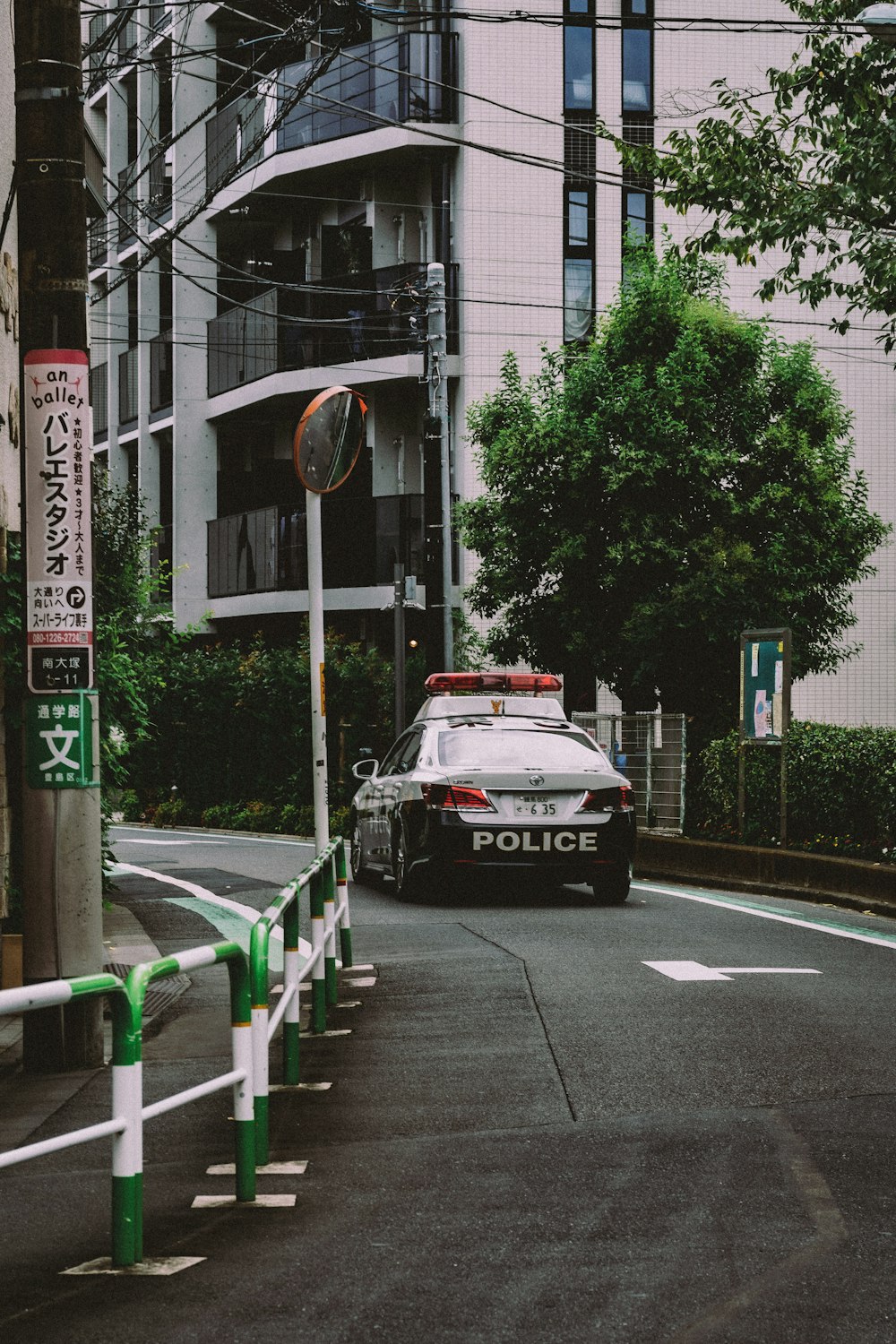 a police car parked on the side of a street