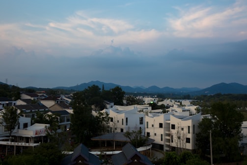 A serene landscape showing a fusion of traditional Anatolian village and futuristic elements under soft pastel skies.