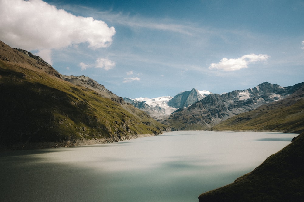 a body of water with a mountain in the background