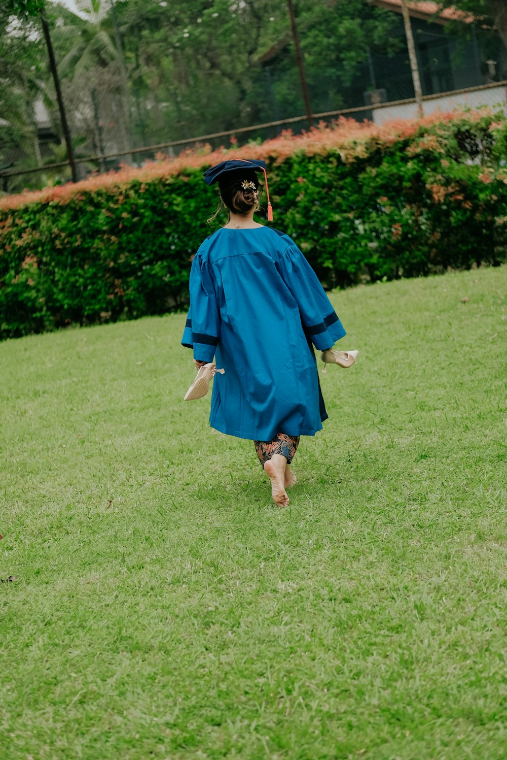 a person wearing a graduation gown